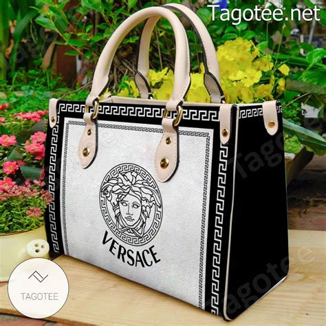 versace pouch|Versace black and white purse.